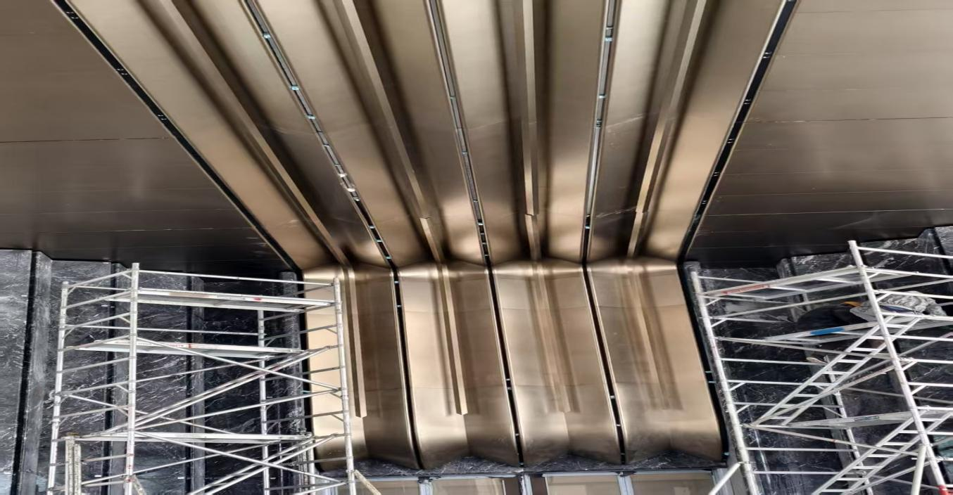 High-End Custom PVD Champagne Gold Stainless Steel Double-Curved Ceiling for Real Estate Showrooms
